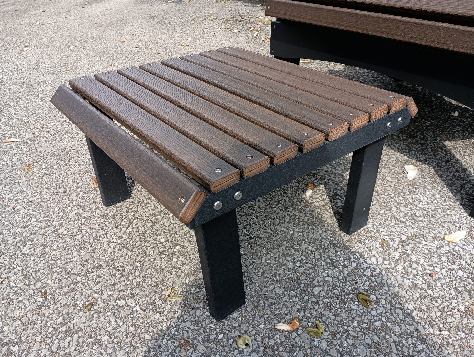Stationary Poly Footstool in Brazilian Walnut on Black