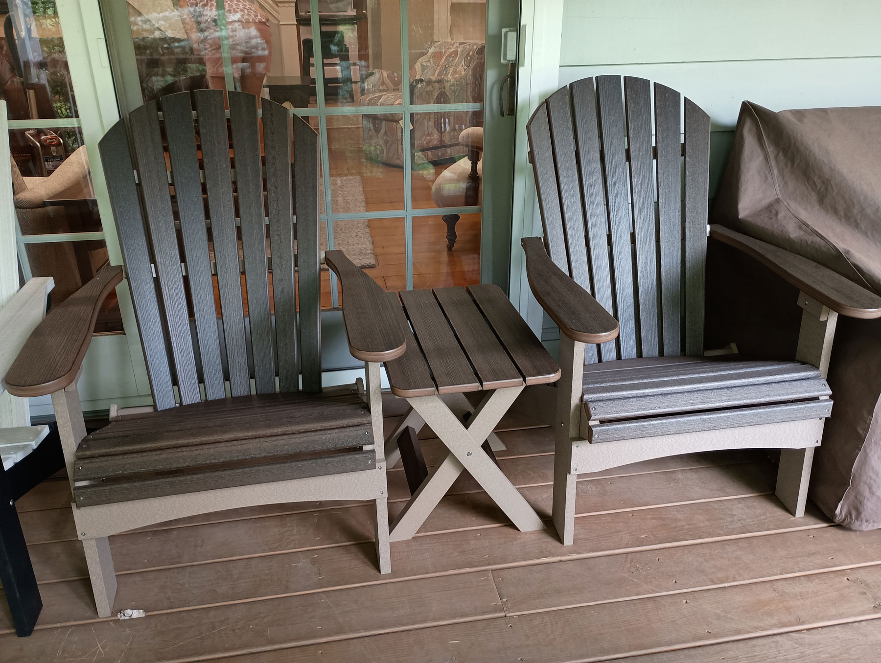 (2) Comfo-Back Folding Adirondacks and (1) Folding End Table in Brazilian Walnut on Weatherwood