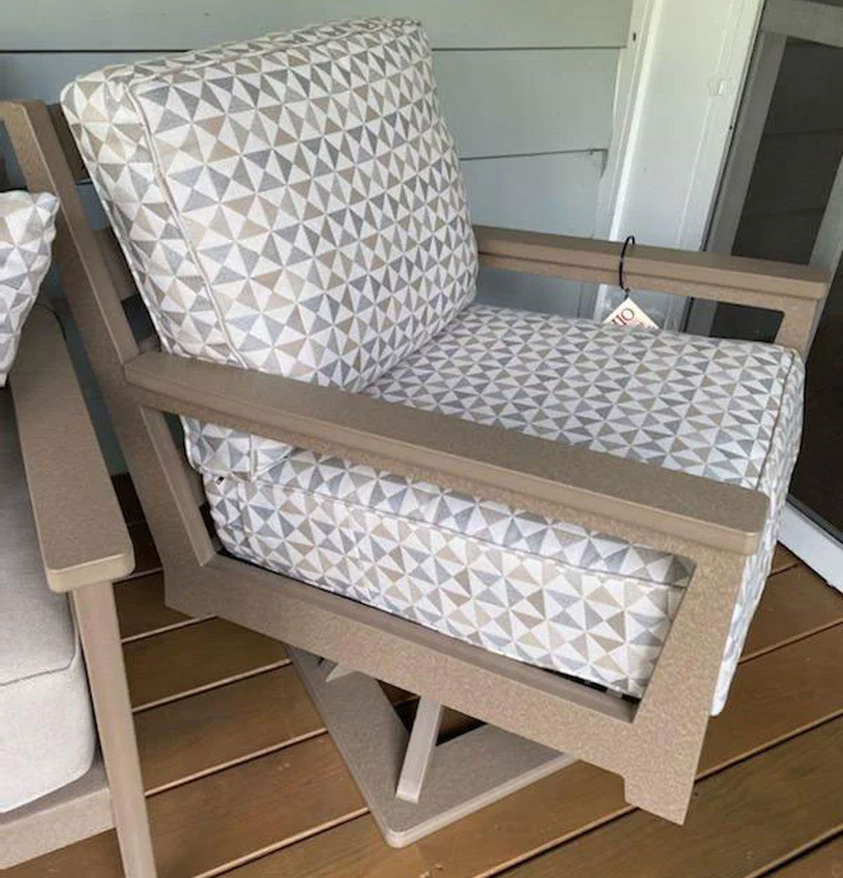 Mayhew Swivel Rocker in Weatherwood with Array Dune Sunbrella Fabric Cushions