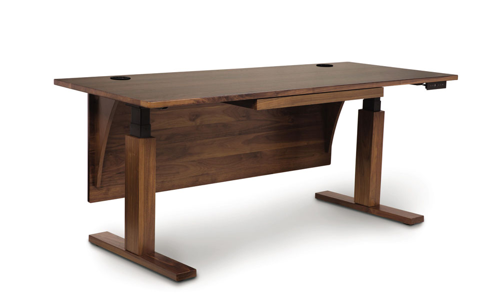 Invigo Desk in Walnut with Optional Modesty Panel in Sitting Position