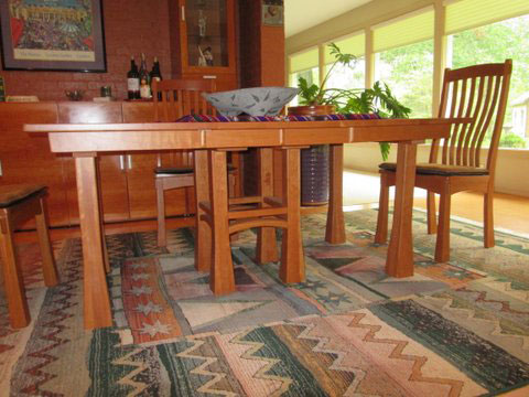 Single pedestal table with optional outer corner legs that are removeable.  These legs help single pedestal tables with extension leaves that are unstable when extended.